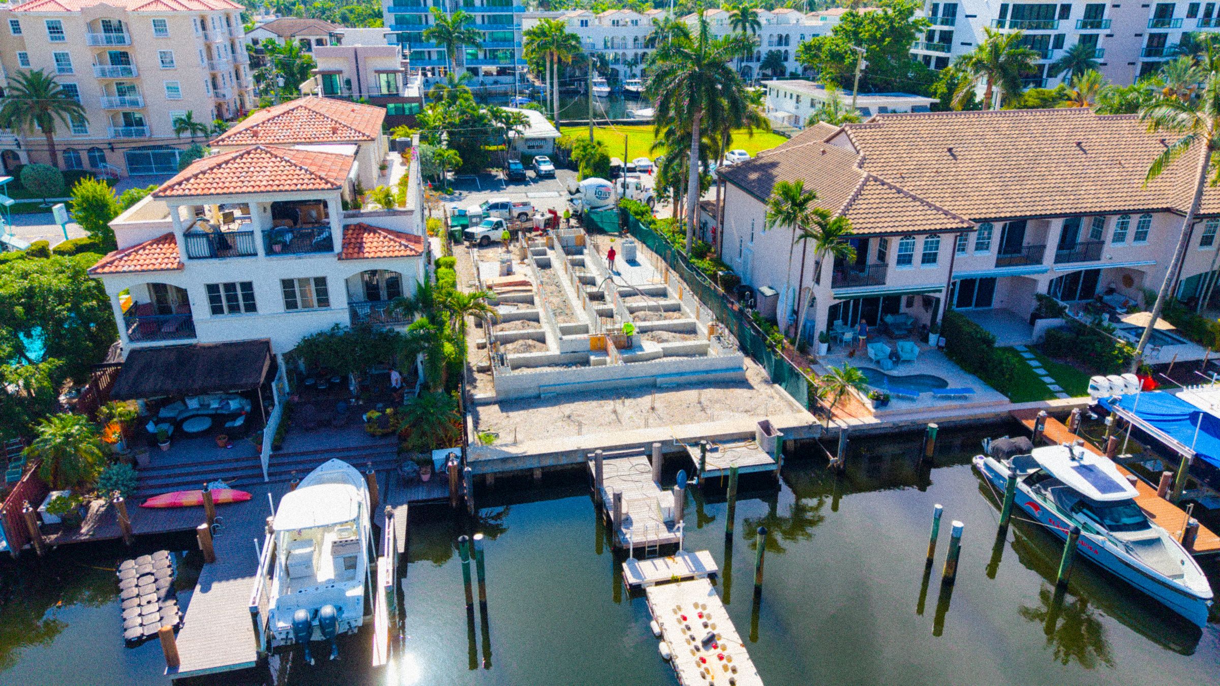 Seawall and private dock with a yacht in front of a Fort Lauderdale waterfront lot